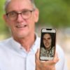 Paul Raoult, the father of Sebastien Raoult, shows a picture of his son on his phone